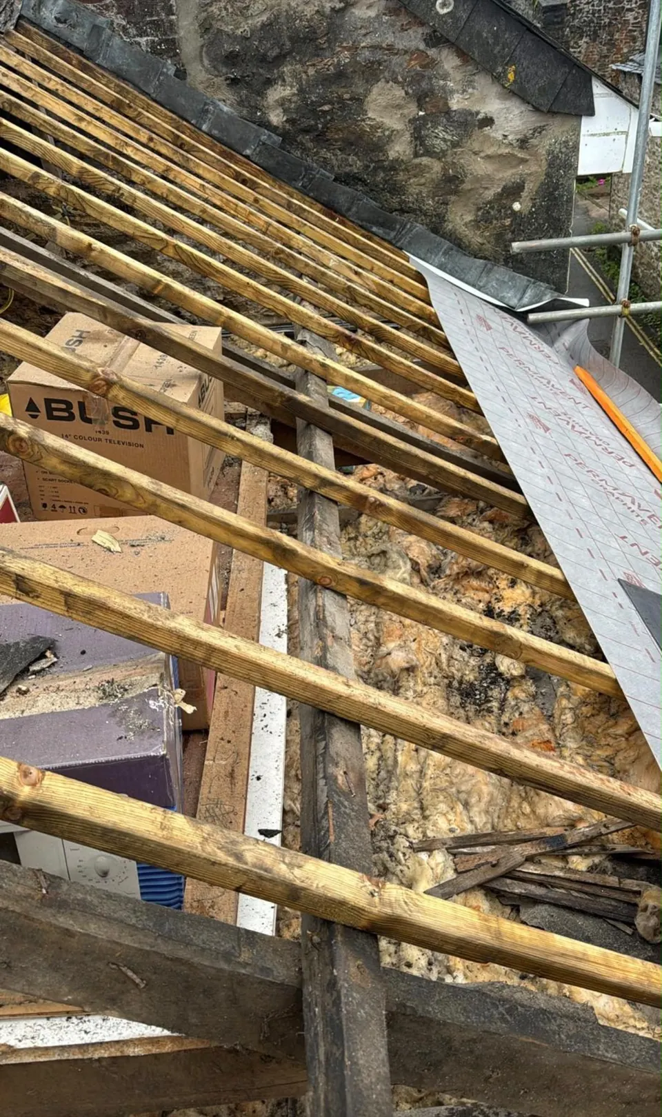Old rotten battens and roof timbers exposed once the old covering was stripped off